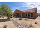 Stylish backyard with low-maintenance desert landscaping, a patio, and scenic golf course views at 1407 Wheelwright Ct, Mesquite, NV 89034