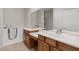 Bathroom featuring double sinks, walk-in tub, and separate shower at 1407 Wheelwright Ct, Mesquite, NV 89034