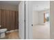 Bright bathroom featuring tile flooring, toilet and a peek into a spacious bedroom with natural light at 1407 Wheelwright Ct, Mesquite, NV 89034