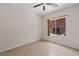 Neutral bedroom featuring a ceiling fan, tile floor and a window with view to the outside AC unit at 1407 Wheelwright Ct, Mesquite, NV 89034