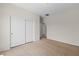 Bright bedroom featuring a large closet with sliding doors and neutral-colored carpet at 1407 Wheelwright Ct, Mesquite, NV 89034
