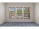 Sunlit bedroom with three windows offering peaceful views and natural light at 1407 Wheelwright Ct, Mesquite, NV 89034