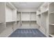 Spacious walk-in closet with multiple shelves and hanging rods for ample storage at 1407 Wheelwright Ct, Mesquite, NV 89034