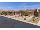 Charming home featuring a well-maintained yard with desert landscaping at 1407 Wheelwright Ct, Mesquite, NV 89034