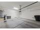 Spacious garage with painted walls, concrete floor, water heater, and storage shelves at 1407 Wheelwright Ct, Mesquite, NV 89034