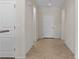 Hallway showing neutral colors and tile floors at 1407 Wheelwright Ct, Mesquite, NV 89034