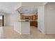 Open kitchen layout with granite countertops, breakfast bar, and access to the outdoors at 1407 Wheelwright Ct, Mesquite, NV 89034