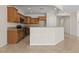 Well-equipped kitchen boasts stainless steel appliances, granite counters, and breakfast bar at 1407 Wheelwright Ct, Mesquite, NV 89034