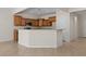 Open kitchen with granite countertops, wood cabinets, and modern appliances at 1407 Wheelwright Ct, Mesquite, NV 89034