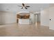 Spacious living room with tile flooring, an open floor plan and neutral-colored walls at 1407 Wheelwright Ct, Mesquite, NV 89034