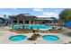 Beautiful pool area with spa and lounge chairs, surrounded by desert landscaping, creating a resort-like atmosphere at 1407 Wheelwright Ct, Mesquite, NV 89034