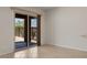 A sliding glass door leads to a patio with views of the surrounding desert landscape at 1407 Wheelwright Ct, Mesquite, NV 89034
