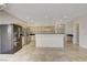 Spacious kitchen with stainless steel appliances, breakfast bar, and tile flooring at 1408 Reebok Ter, Henderson, NV 89014