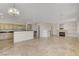 Open living area with breakfast bar, fireplace, and tile flooring throughout at 1408 Reebok Ter, Henderson, NV 89014