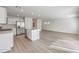 Kitchen and open living room area, filled with stainless steel appliances and a center island at 1425 Gable Falls Dr # 93, North Las Vegas, NV 89084