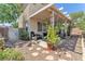 Serene backyard area with pavers, gravel, covered patio, and lush landscaping at 1476 Evening Song Ave, Henderson, NV 89012