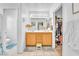 Well-lit bathroom featuring a double sink vanity and ample storage and separate closet at 1476 Evening Song Ave, Henderson, NV 89012