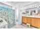 Bathroom with a dual sink vanity, floral shower curtain, and tiled floors at 1476 Evening Song Ave, Henderson, NV 89012