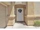 Charming front door entrance framed by decorative columns and a festive wreath at 1476 Evening Song Ave, Henderson, NV 89012