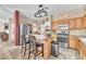 Well-equipped kitchen with granite countertops, stainless steel appliances, and a center island at 1476 Evening Song Ave, Henderson, NV 89012