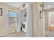 Bright laundry area with in-unit washer, blinds, and shelving for storage solutions at 1476 Evening Song Ave, Henderson, NV 89012
