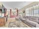 Bright and airy living room featuring modern furniture and ample seating arrangements at 1476 Evening Song Ave, Henderson, NV 89012