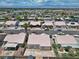 Panoramic aerial view showcasing a residential neighborhood with desert landscaping and mountain views at 1728 Crystal Chimes Dr, Las Vegas, NV 89106