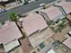 Home features a spacious backyard and desert landscaping, as seen from an aerial view at 1728 Crystal Chimes Dr, Las Vegas, NV 89106