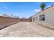 Spacious backyard with a cinder block wall, offering privacy and potential for customization at 1728 Crystal Chimes Dr, Las Vegas, NV 89106