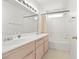 Bright bathroom featuring double sinks, a large mirror, and a shower-tub combination at 1728 Crystal Chimes Dr, Las Vegas, NV 89106