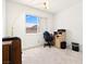 Functional bedroom with a large window, a desk area, and ample space for storage at 1728 Crystal Chimes Dr, Las Vegas, NV 89106