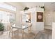 Bright dining space with a large window and decorative accents, perfect for entertaining at 1728 Crystal Chimes Dr, Las Vegas, NV 89106