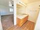 Bathroom with a tiled countertop, a large mirror, and a partial view into an adjacent room at 1951 Teepee Rd, Pahrump, NV 89048
