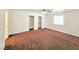 Spacious bedroom with a ceiling fan, large window and dual closets, providing ample storage at 1951 Teepee Rd, Pahrump, NV 89048