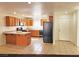 Functional kitchen with tile flooring, oak cabinets, and appliances with ample countertop space at 1951 Teepee Rd, Pahrump, NV 89048