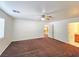 Bright living room with open doorway to a kitchen with dark appliances at 1951 Teepee Rd, Pahrump, NV 89048
