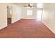 Expansive living room featuring neutral walls and plush carpeting at 1951 Teepee Rd, Pahrump, NV 89048