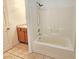 Bathroom area with a white tiled bathtub and shower combination at 1951 Teepee Rd, Pahrump, NV 89048