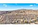 Wide aerial shot of a planned community, showcasing the surrounding desert landscape and mountain views at 2225 Chandler Ranch Pl, Laughlin, NV 89029