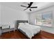 Bedroom with desk, wood floors, ceiling fan, white trim and natural light at 2250 Bowie Cir, Henderson, NV 89014