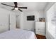 Bedroom with closet, wood floors, ceiling fan, white trim and natural light at 2250 Bowie Cir, Henderson, NV 89014