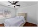 Bedroom with wood floors, ceiling fan, white trim and natural light at 2250 Bowie Cir, Henderson, NV 89014