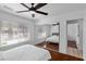 Bedroom with closet, wood floors, ceiling fan, white trim and natural light at 2250 Bowie Cir, Henderson, NV 89014