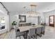 Dining area featuring a modern chandelier, ample seating, and views of the backyard at 2250 Bowie Cir, Henderson, NV 89014