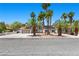 Charming home with desert landscaping, mature palm trees, and a two-car garage at 2250 Bowie Cir, Henderson, NV 89014
