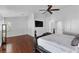 Bright, open main bedroom featuring wood floors, a decorative ceiling fan, and ensuite access at 2250 Bowie Cir, Henderson, NV 89014