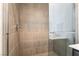 Tiled shower with glass door in a modern bathroom setting at 2501 Indigo Mountain St, Henderson, NV 89044