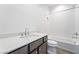 Clean bathroom featuring a single sink and bathtub with shower at 2501 Indigo Mountain St, Henderson, NV 89044