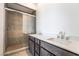 Modern bathroom featuring dual sinks and a glass-enclosed shower at 2501 Indigo Mountain St, Henderson, NV 89044