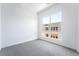 Bright bedroom with plush carpet and a large window offering natural light and neighborhood views at 2501 Indigo Mountain St, Henderson, NV 89044